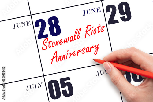 June 28. Hand writing text Stonewall Riots Anniversary on calendar date. Save the date. Holiday. Day of the year concept.