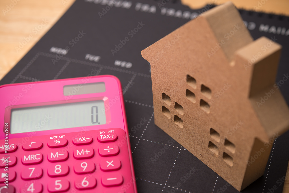 House model, calendar and calculator. Mortgage loan for buying home or real estate property, home finance, money saving planning, money risk management, installment schedule, tax and so on concept. House model, calendar and calculator. Mortgage loan for buying home or real estate property, home finance, money saving planning, money risk management, installment schedule, tax and so on concept.