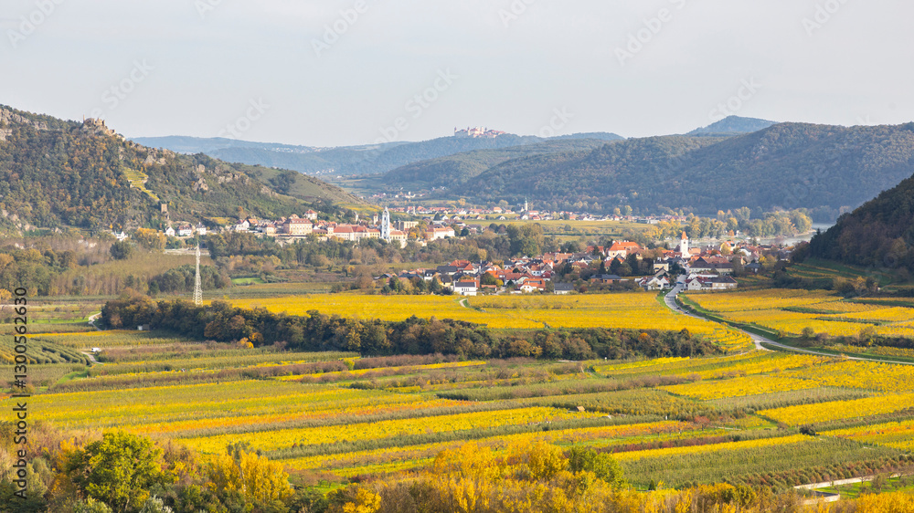 Naklejka premium Durnstein in the Wachau winery region in Austria. Danube Valley in autumn colors. Idyllic landscape and famous tourist destination.