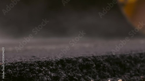 Asphalt Paving. Road Roller Drives Over Hot, Steaming, Freshly Layed Asphalt. Road Roller, Roller-compactor or Roller is a Compactor-type Engineering Vehicle Used to Compact Asphalt.