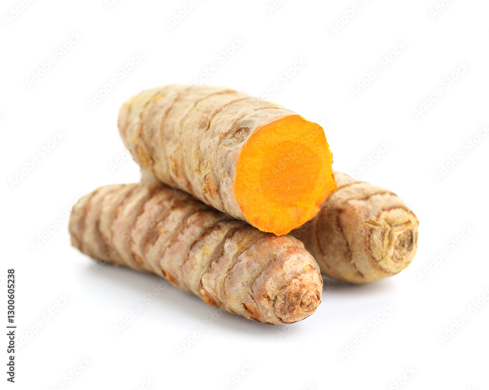 Whole and cut turmeric roots isolated on white Whole and cut turmeric roots isolated on white