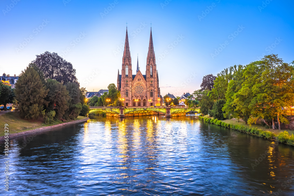 Saint Paul church in Strasbourg canal reflection sunset view