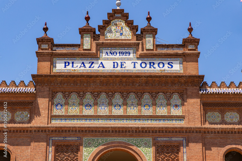 Obraz premium Las Ventas bullring, Madrid, Bull square. Plaza de toros. Events and traditions of Spain. Red sand under a burning sun. No people. Fight between matador and bull. Blood, passion, dance, celebration.