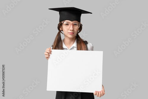 Schoolgirl in graduation ha...