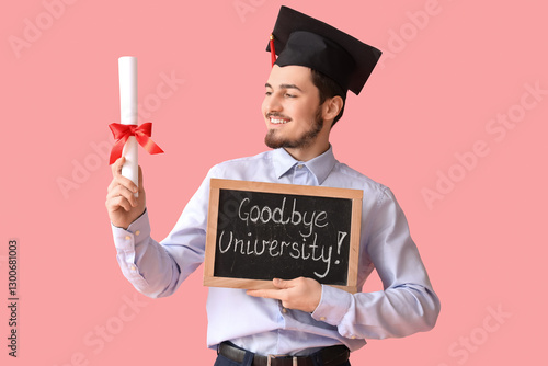 Male graduate student holdi...