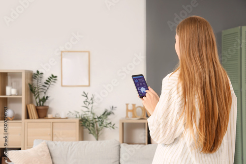 Young woman using mobile ph...