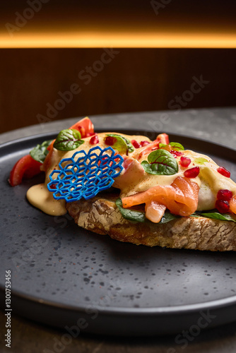 Obraz na płótnie Gourmet open-faced salmon sandwich with vibrant toppings, ornate design on dark plate, stylish presentation food concept w salonie