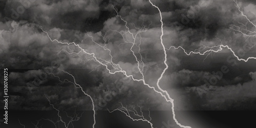 Thunder, lightnings and rain on a stormy summer night in black and white. Lightning bolts in the sky at night. 
