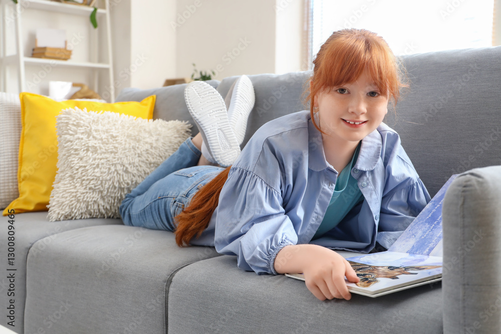 Cute redhead girl reading book at home Cute redhead girl reading book at home