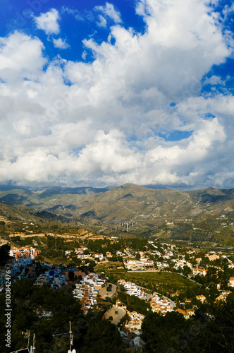 The sea and mountains are landscaped with clouds and sunny weather. Mirador de Cerro gordo