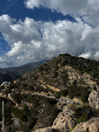 The sea and mountains are landscaped with clouds and sunny weather. Mirador de Cerro gordo