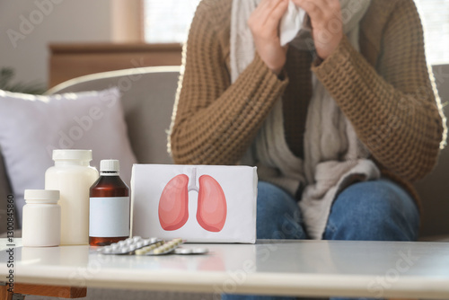 Medicines on table and woma...