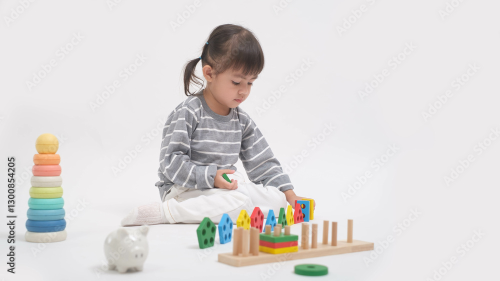 A young child playing with educational toys, focusing intently on a wooden puzzle, surrounded by colorful objects, promoting early learning and development. A young child playing with educational toys, focusing intently on a wooden puzzle, surrounded by colorful objects, promoting early learning and development.
