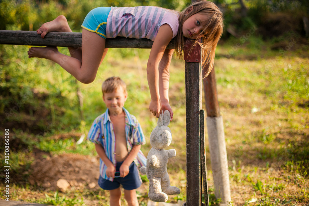 Children, a brother and sister, playing together in a village during summer, radiating joy and innocence.