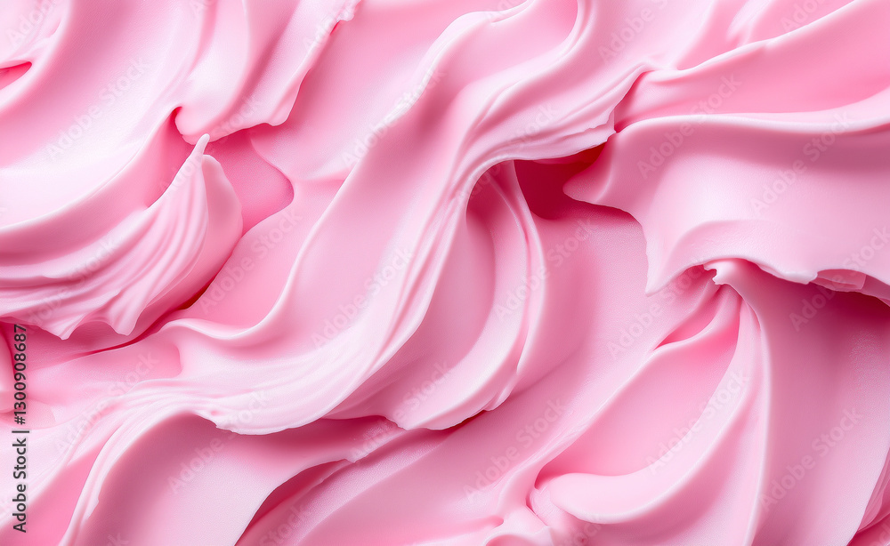 Fototapeta premium A close-up of soft, swirled pink frosting, creating a smooth and creamy texture.