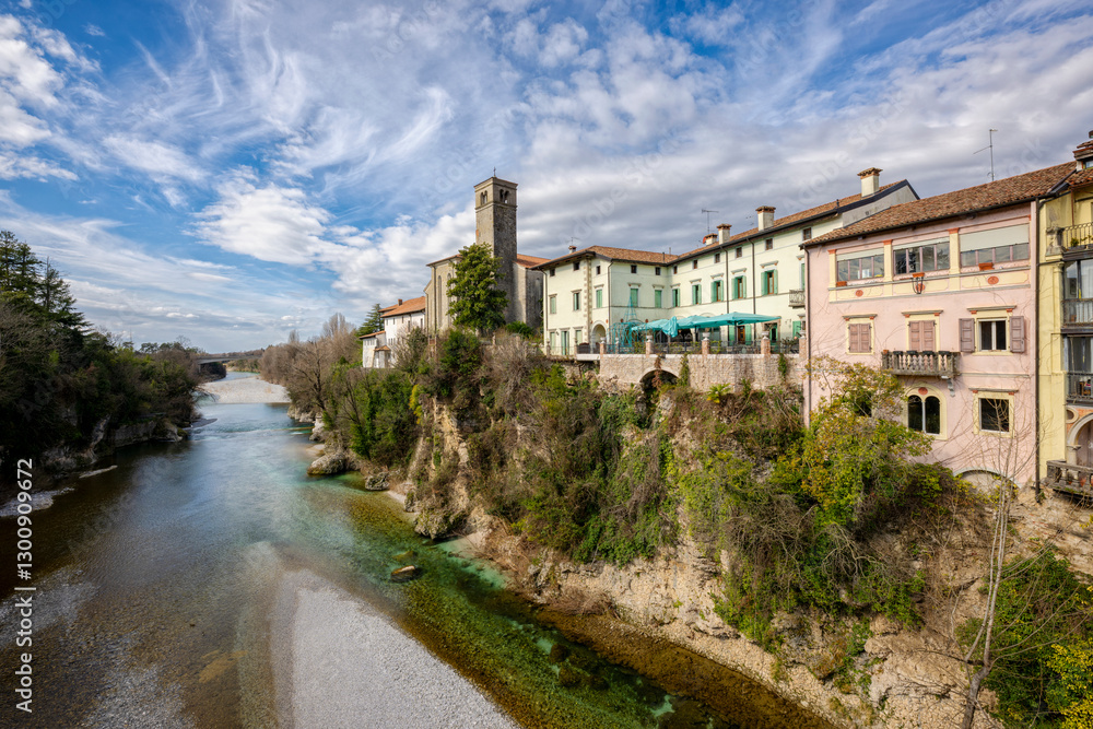 View of Cividale del Friuli facing on the Natisone river. Beautiful Italian cityscape of a medieval town. Udine province, Friuli Venezia Giulia, Italy. View of Cividale del Friuli facing on the Natisone river. Beautiful Italian cityscape of a medieval town. Udine province, Friuli Venezia Giulia, Italy.