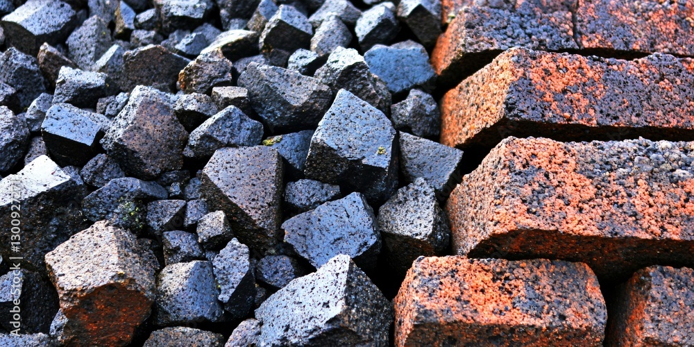 Industrial Raw Materials: A striking juxtaposition of dark coal and rustic bricks showcases the raw materials fundamental to industry and construction. Industrial Raw Materials: A striking juxtaposition of dark coal and rustic bricks showcases the raw materials fundamental to industry and construction.