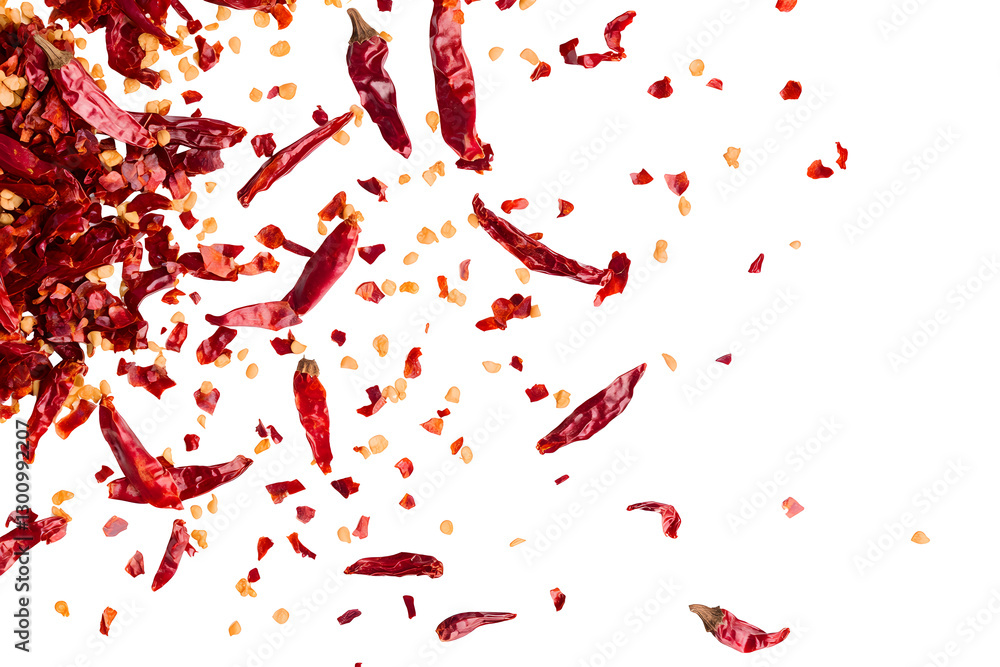 Red chili pepper flakes and seeds falling against a black background. A vibrant and spicy image. Red chili pepper flakes and seeds falling against a black background. A vibrant and spicy image.