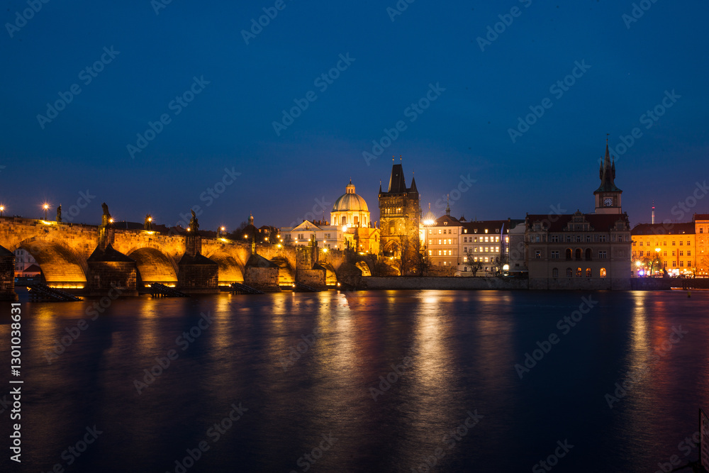 Fototapeta premium Prague old town city center skyline at night, capital of Czech Republic, River Vltava mirroring beautiful night city lights 