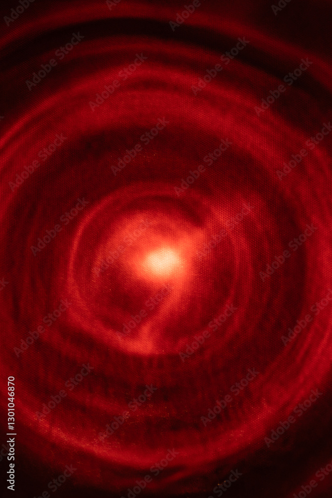 A mesmerizing abstract image featuring swirling red concentric circles with a glowing center. The dynamic light pattern creates a sense of depth and movement, evoking energy and mystery. A mesmerizing abstract image featuring swirling red concentric circles with a glowing center. The dynamic light pattern creates a sense of depth and movement, evoking energy and mystery.