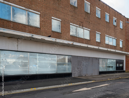 Closed and empty shops in a shopping centre depicting the dying UK high street.