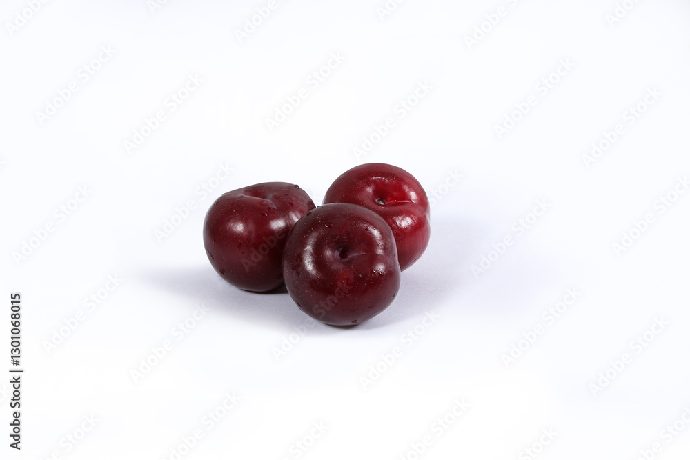 read plum fruits in white background read plum fruits in white background