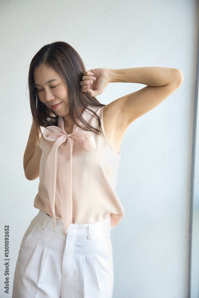 Asian middle aged woman taking a break, healthy relaxing time and stretching her muscle Asian middle aged woman taking a break, healthy relaxing time and stretching her muscle