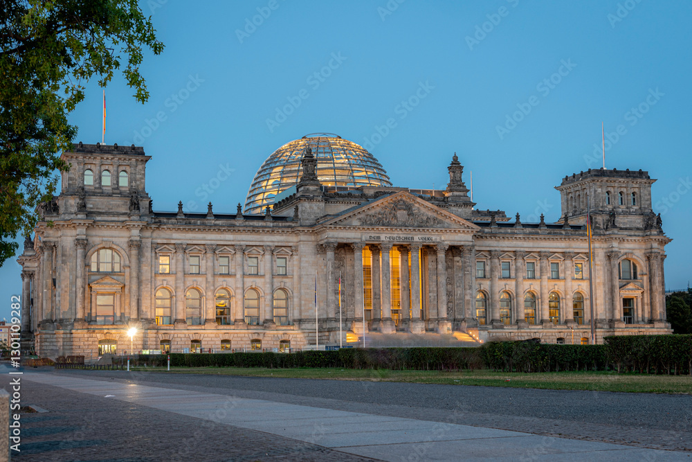 Obraz premium The Reichstag in blue hour, a historic legislative government building on Platz der Republik in Berlin, is the seat of the German Bundestag