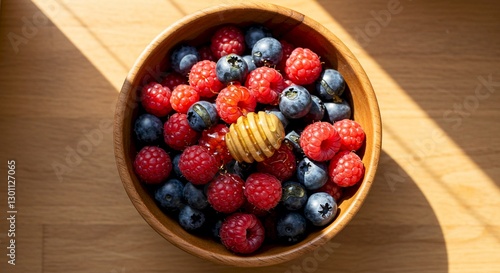 Sunlit Bowl of Raspberries Blueberries Honey