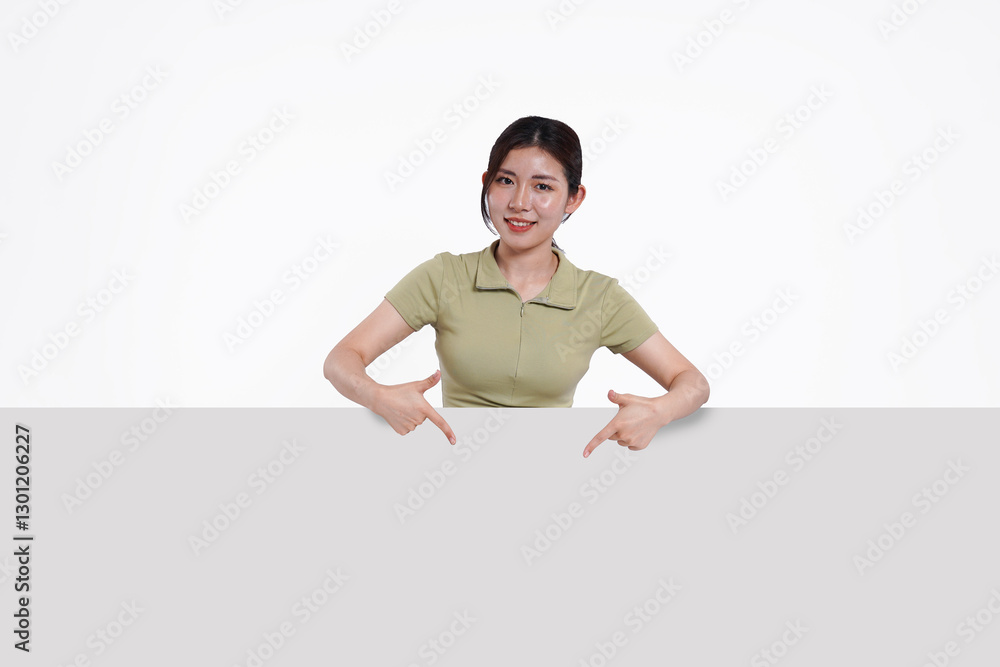 image of Asian girl standing and posing with billboard