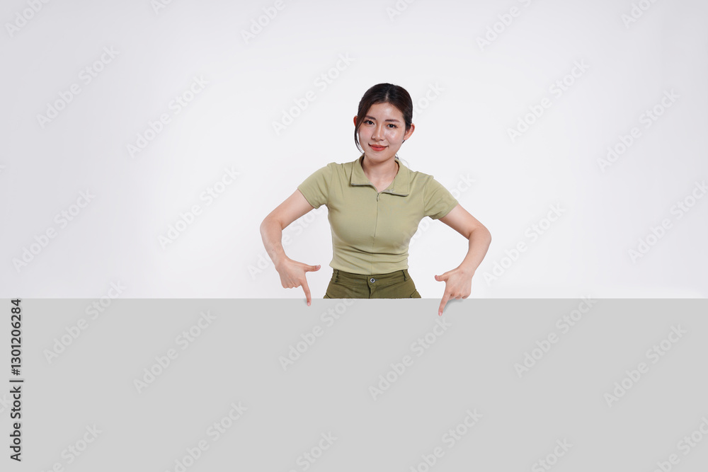 image of Asian girl standing and posing with billboard image of Asian girl standing and posing with billboard