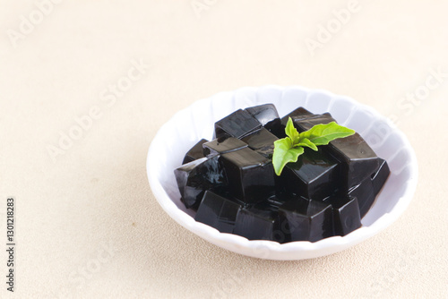 cincau hitam is black jelly made from the leaves of mesona palustris or other mesona family plant. its One of the popular ingredient desert menu when breaking the fast. selected focus photo