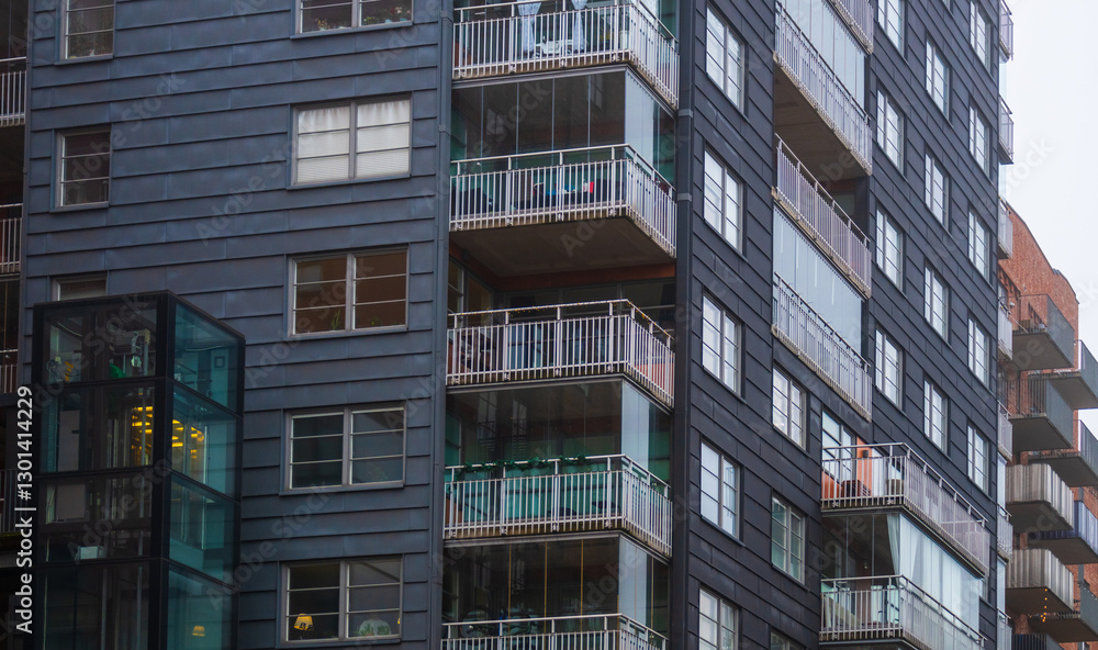 Obraz premium modern residential building with glass balconies.