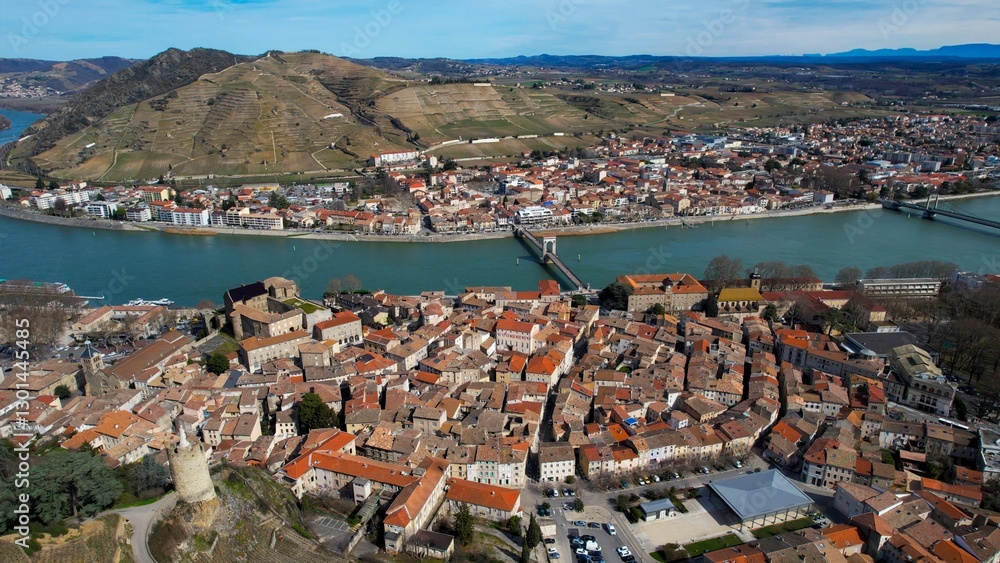 Aerial panoramic view around the old town of the city Tournon-sur-Rhonein in France on a sunny afternoon in spring.