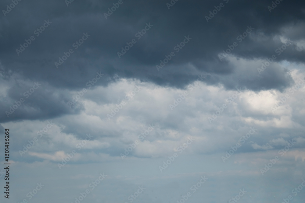 Dramatic stormy sky background. Dark fluffy cloudy sky. Halloween cloudscape background concept. Dramatic stormy sky background. Dark fluffy cloudy sky. Halloween cloudscape background concept.