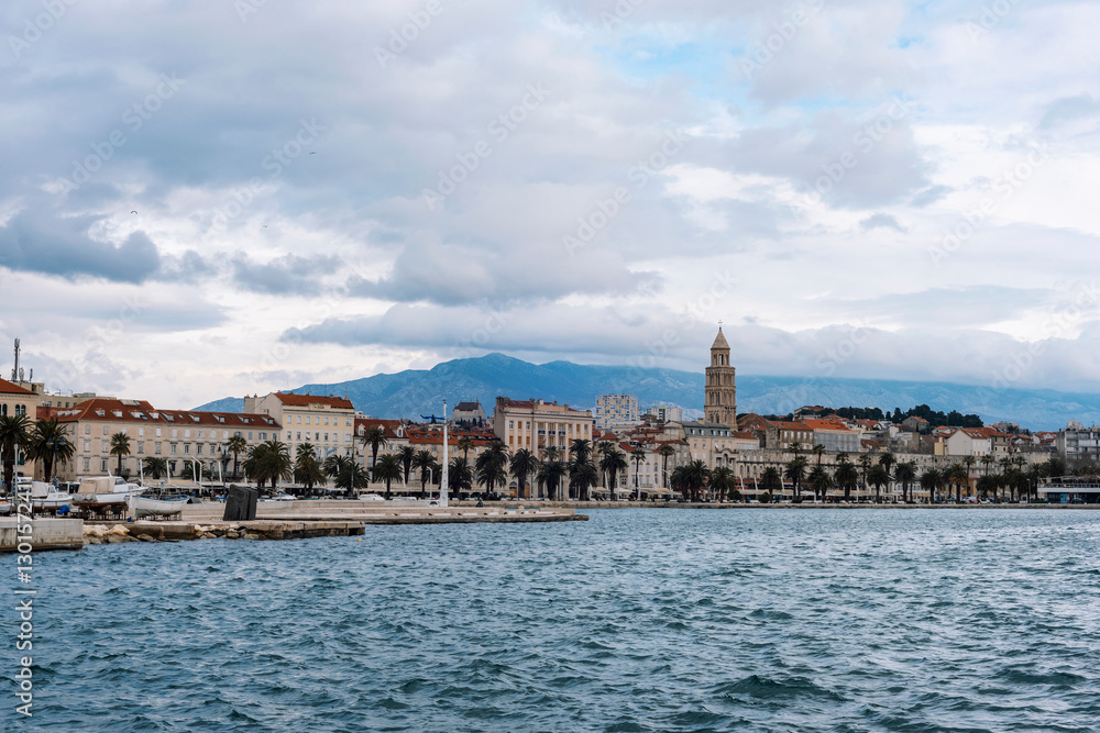 Naklejka premium Seaside cityscape of Split, Croatia with historic architecture and mountain background