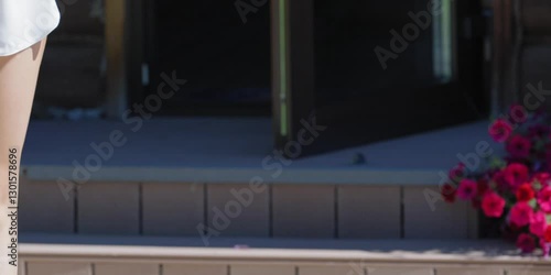 legs of a beautiful girl going down the stairs to the backyard