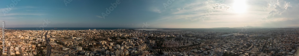 Panoramic aerial cityscape with urban sprawl. Panoramic aerial cityscape with urban sprawl.