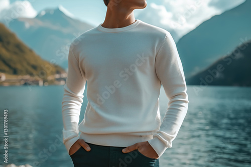 Fototapeta Naklejka Na Ścianę i Meble -  Close-up of a young man model wearing a blank template white longsleeve by the lake
