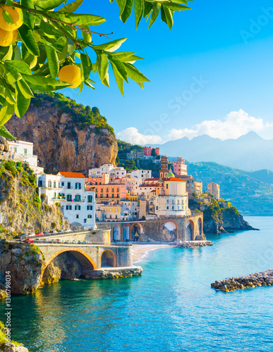 Beautiful view of Amalfi on the Mediterranean coast with lemons in the foreground, Italy