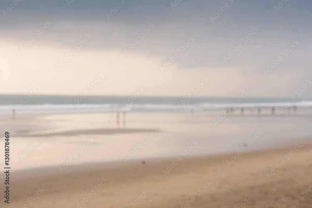 Blurry background of people at beach with cloudy at sunset Blurry background of people at beach with cloudy at sunset