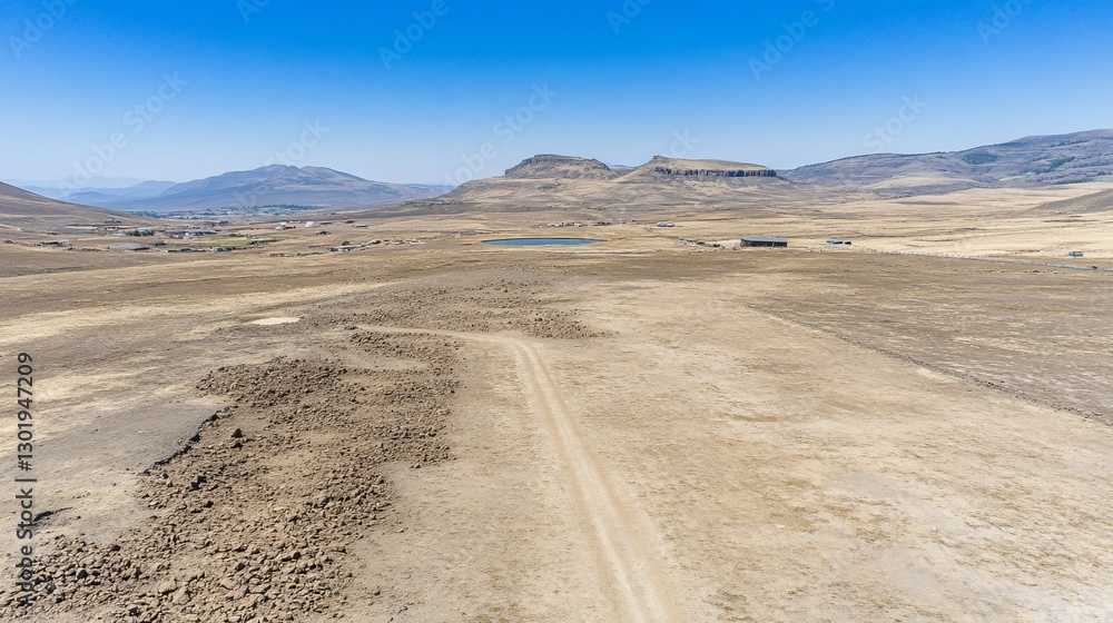 Aerial view Dirt road, arid landscape, mountains, rural development Aerial view Dirt road, arid landscape, mountains, rural development