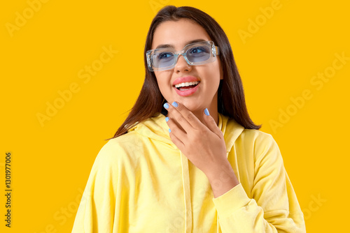 Beautiful young woman in st...