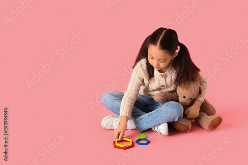 Little Asian girl with auti...
