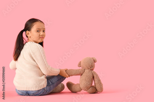 Little Asian girl with auti...