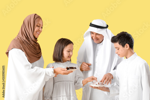 Happy Muslim family with tr...