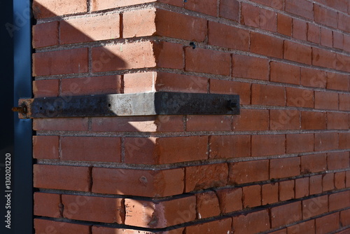 Wallpaper Mural Metal bracket on corner of brick building. Torontodigital.ca