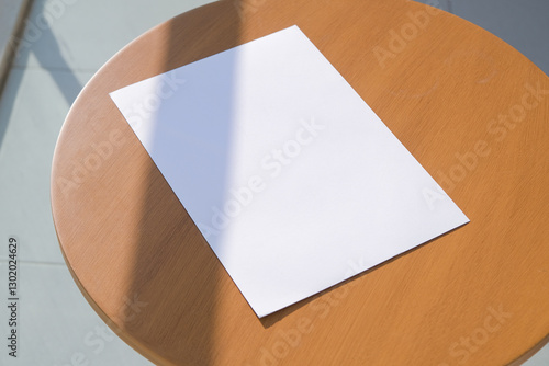 Wallpaper Mural paper a4 mockup design. blank paper poster mockup on wooden coffee table , shadow overlay Torontodigital.ca