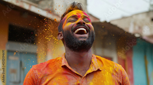 Wallpaper Mural A joyful man covered in vibrant colored powders smiles widely, celebrating a festival that symbolizes joy and unity. Torontodigital.ca