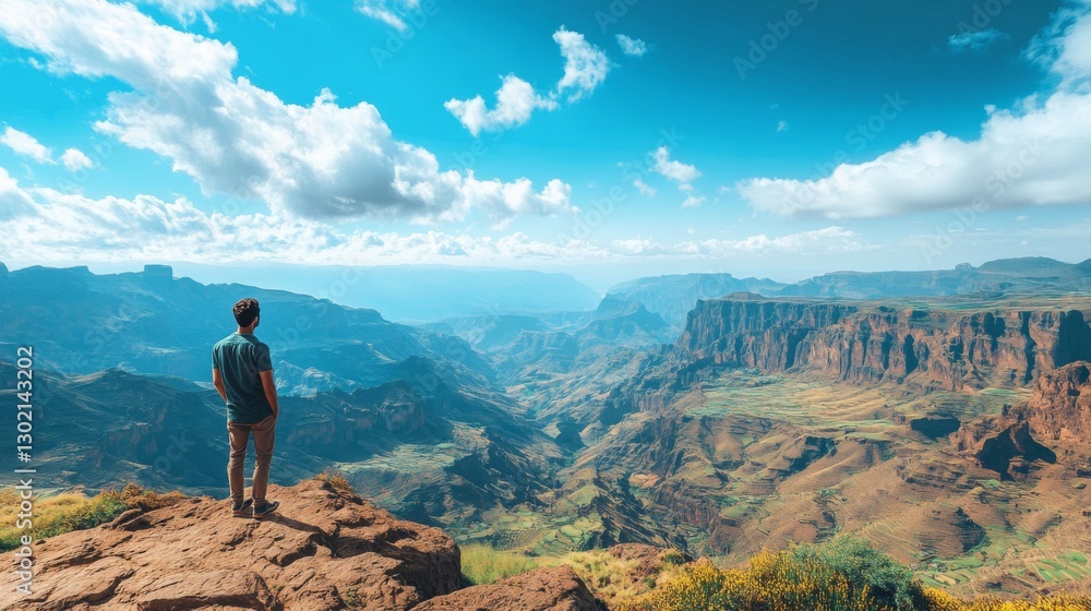 Obraz premium Man contemplates vast Ethiopian mountain landscape